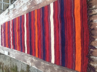 Colorful kilim striped runner/strip. Cm 67x256. 90 to 100 years of age. Most probably Anatolian. Very fine weave. Great colors. Red, orange, blue and white. Warps are dyed in aubergine!! Very unusual.  ...