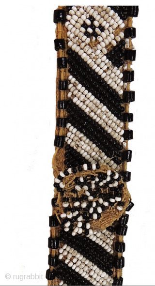 Kuba people beaded headband - Congo. Mid 20th century or earlier. Cm 73x3 ca. Raffia, cowry shells, beads.
Such headbands were worn by nobles of Kuba royal families. They were the sign of  ...