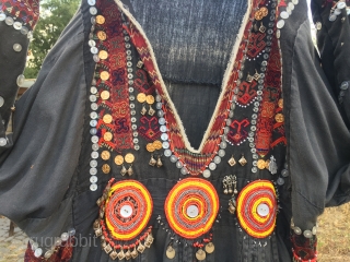 Nuristan. Jumlo or woman wedding dress from Kohistan/Nuristan, Northern Pakistan and Afghanistan. Heavily silk embroidered on black cotton, with lots of white and copper plastic buttons, metal roundels, lead beads, etc. Early  ...