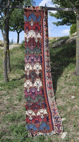 Antique Malatya kilim strip. Size is cm 75x395 or 2'8"x11'2" ca. Age is first quarter 19th century. Colors are simply wonderful: indigo, green, madder, cochineal, aubergine, etc....all fantastic. Some brown must have  ...