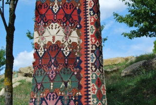 Antique Malatya kilim strip. Size is cm 75x395 or 2'8"x11'2" ca. Age is first quarter 19th century. Colors are simply wonderful: indigo, green, madder, cochineal, aubergine, etc....all fantastic. Some brown must have  ...