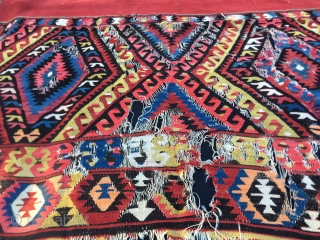 19th Century Fethiye camel cover kilim fragment. Cm 145x235. Antique, beautiful & rare. Distressed but powerful, very powerful. Still "alive", speaking! Needs either a loving collector or a skilful restorer. Great colors  ...