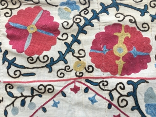 Suzani Kapunuk. 
Cm 142x216. 
Late 19th or early 20th century. 
Silk on cotton. 
Wonderful natural colors. 
Great workmanship. 
In good condition. 
Some black stitches are oxidized as you can see from the  ...