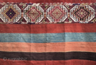 Malatya area, Sinanli tribe open cuval/storage bag. Cm 118x156. Late 19th, early 20th c. Flat weave plus sumack in the central part. Some metal thread. Natural colors. Two, three small holes, but  ...