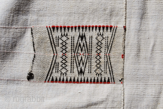 Nagaland. 
Naga Angami tribe cotton body cloth. 
Size is cm 92x173.
All cotton, hand loomed, super weaving.
Datable mid 20th century. 
In good condition, one stain to report, needs professional washing.
Acquired in Burma in  ...