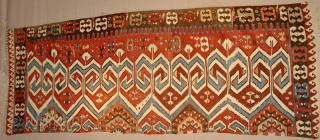 Aydin Kilim. 
Powerful & Beautiful Western Anatolia Aydinli kilim strip. 
Cm 100x265 ca. 
3rd/4th q 19th century. 
Great ram horn pattern, glorious natural saturated colors. 
Condition: a few minor oxidations, two tiny  ...