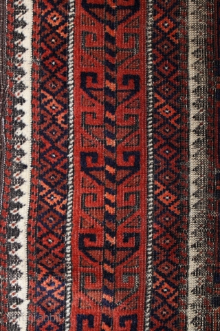 Baluch Timuri, a so called Sangtshuli; about 1880; 105 x 186cm (3`5”x 6`1”) rare seen main border (not found comparable border in Baluch rug books), like a row/chain of triangle amulets (an  ...