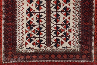 Baluch white ground Prayer rug; beginning 20th c.; 98 x 166 cm (3`3” x 5`5”); one says that Baluch prayer rugs with white ground are rare, this one has also in its  ...