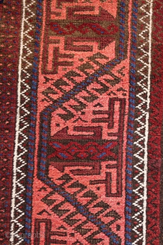 Baluch long rug runner; 118 x 393 cm (3`11“ x 12`11“); after 1920 (?) earlier example from a rare size for Baluch rugs; Main field with a lattice which contains alternating diagonal  ...