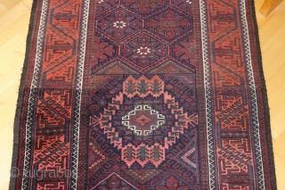 Baluch long rug runner; 118 x 393 cm (3`11“ x 12`11“); after 1920 (?) earlier example from a rare size for Baluch rugs; Main field with a lattice which contains alternating diagonal  ...