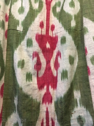 A striking ikat chapan, Uzbekistan early 20th c. It is in good condition with a particularly attractive lining perhaps of Russian printed cotton, finished with binding made of strips of ikat cloth.  ...