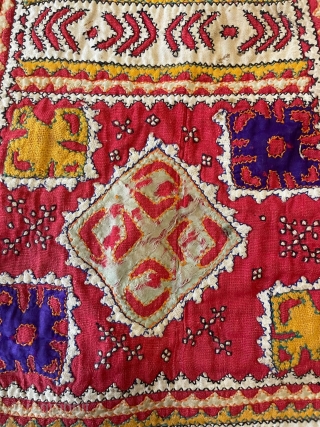 Tobacco bag from Sindh. Applique, patchwork and embroidery on a cotton ground. Mid 20th century. Shows signs of wear (see photos), but is cheerful and attractive.       