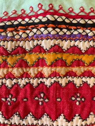 Tobacco bag from Sindh. Applique, patchwork and embroidery on a cotton ground. Mid 20th century. Shows signs of wear (see photos), but is cheerful and attractive.       