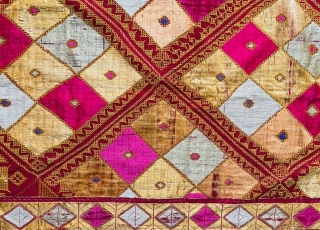 Phulkari from the Punjab embroidered in soft floss silk in shades of yellow, cream, pink and pale green with touches of violet, on rather coarse rust coloured khaddar (hand-loomed cotton) in two  ...