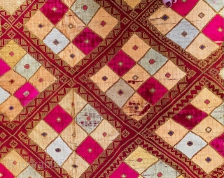 Phulkari from the Punjab embroidered in soft floss silk in shades of yellow, cream, pink and pale green with touches of violet, on rather coarse rust coloured khaddar (hand-loomed cotton) in two  ...