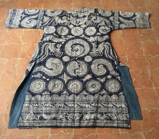 Indigo and white hand drawn batik robe from the Ge minority of the Miao people of SW China. Both the robe and the plain inner lining are pure cotton and the designs  ...