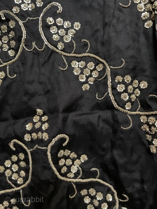 Black silk satin skirt embroidered in a grape vine pattern (symbolizing fertility) worked in silver metal thread and silver sequins. The background cloth is quite heavy, to take the weight of the  ...