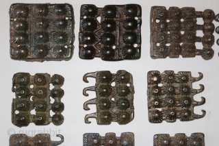 A rare 18 piece group of ancient Tibetan bronze Tokcha armour plates. They appear to be from several different sets. The largest pieces are 82 x 72 mm. and the smallest are  ...