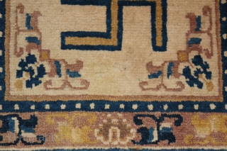 A 19th century ceremonial seating rug. Ningxia, China. 22 x 23 inches.                     