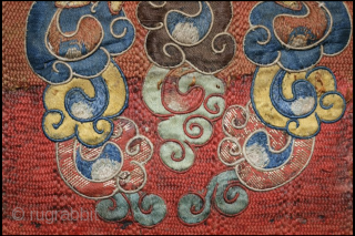 A delightful and very fine Tibetan silk appliqué of Kirrtimukha, or Zpatr. The piece is small and the appliqué elements are likewise very fine. Some areas are embroidered. (see photos) The background  ...