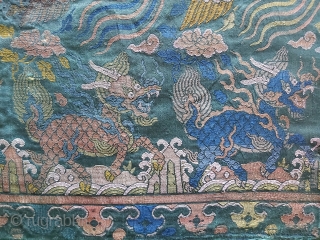Fragment of a Ming Dynasty silk brocade sutra cover with two phoenixes and two Qilins. Some ink staining in several places. (see photos) 16th century.

 14 x 23 inches    