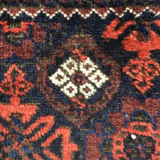 Sweet, small Arab Baluch, 127x81 cm, saturated colours , coral, the red of unripe blackberries, 2 shades of indigo and  olive green which is brown looking in the shadow, lustrous wool,  ...