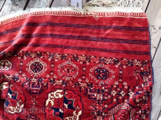 Late 19th/early 20th Century decorative Tekke main carpet, 6'10" x 10'6". Probably a hot red in the details, obvious from the back, but mellow on the front. Unusual in that the skirts  ...