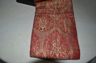 Uzbekistan lady's hat of silk/gilt brocade. The rear hanging portion would have accommodated a pigtail. From the lining late 19th cent / early 20th cent. There is a tarnish across the dome  ...