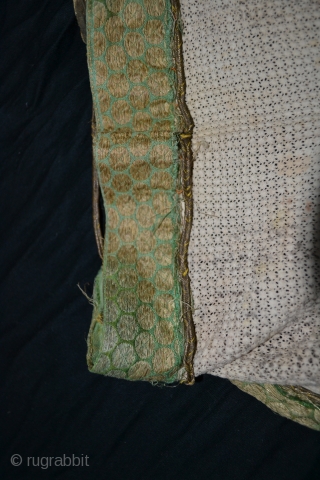 Khotan East Turkistan Tarim cotton lace veil trimmed with gilt / silk brocade.
There is another in my collection. Various precious trims are used as jere with a silk brocade either Indian /  ...