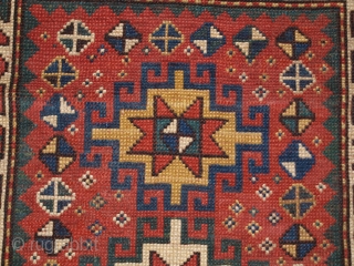 Antique Caucasian Kazak rug of small size with four Memlinc guls. www.knightsantiques.co.uk 

Size: 5ft 2in x 2ft 11in (158 x 90cm)

Circa 1900.

A sweet small Kazak rug with a single vertical row of  ...