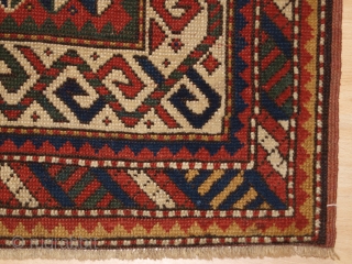 Antique Caucasian Kazak rug of small size with four Memlinc guls. www.knightsantiques.co.uk 

Size: 5ft 2in x 2ft 11in (158 x 90cm)

Circa 1900.

A sweet small Kazak rug with a single vertical row of  ...