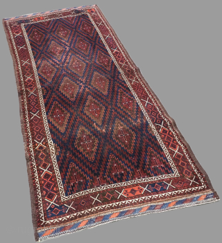 Antique Arab Baluch rug of scarce design from south east Persia. www.knightsantiques.co.uk

Circa 1890.
Size: 6ft 5in x 2ft 11in (196 x 90cm).
This unusual rug has a design of serrated diamond medallions arranged in  ...