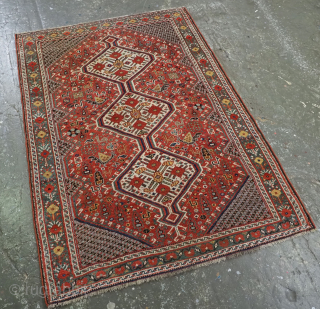 Antique tribal Khamseh Rug with triple linked medallions with pomegranate design.
Size: 4ft 10in x 3ft 5in (147 x 105cm).
Circa 11900.

An excellent small tribal rug with a central ivory triple medallion containing pomegranate  ...