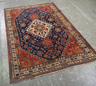 Antique south west Persian Qashqai tribal rug of small size.
Size: 6ft 3in x 4ft 4in (190 x 133cm).
Circa 1900.

A good Qashqai rug with a single medallion containing the Qashqai emblem on an  ...