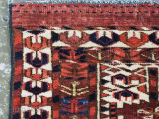 Size: 2ft 2in x 10in (65 x 25cm).

Antique Tekke Turkmen 'kap' or mafrash, small storage bag face.

Circa 1850.

An outstanding example of a Tekke kap, with the three panel tree design. The face  ...