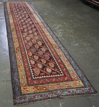 Antique Caucasian Karabagh region runner with all over diagonal boteh design.
www.knightsantiques.co.uk
Circa 1880.
Size: 14ft 1in x 3ft 5in (430 x 104cm).
A very good runner with diagonal rows of flowering boteh on a charcoal  ...