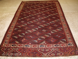 Antique Yomut Turkmen main carpet with the ‘Dyrnak’ gul design and curl leaf border. www.knightsantiques.co.uk 

Circa 1890.

The carpet has a rich brown ground colour with some very nice blues, greens, ivory and  ...