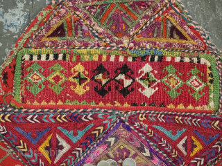 Antique Turkmen child's bib / tunic, decorated with white metal discs and other devices to ward off evil. A beautiful collectors display object.          