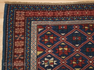 Antique Caucasian Seichur rug with star and lattice design. www.knightsantiques.co.uk 

Circa 1880.

This charming rug has a dark indigo blue field covered with a fine diamond lattice, with each diamond containing a eight  ...