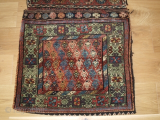 Antique Kurdish Varamin region Khorjin with plain weave back. www.knightsantiques.co.uk 

Circa 1900.

The saddle bag faces are drawn with a diagonal repeat boteh design surrounded by a Turkmen inspired design border on a  ...