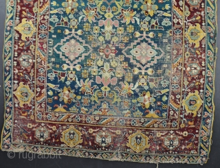 A beautiful Agra rug in horrible condition! Fabulous ground colour and drawing that is reminiscent of much earlier weaving. Mid-19th century. 197x120cm           