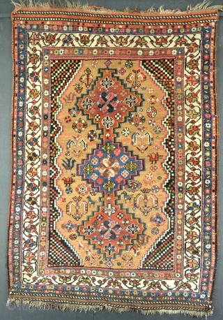 Old Khamseh rug on scarce camel ground. Mainly in good pile, slightly lower in places. Clean and floor ready. Circa 1900.            