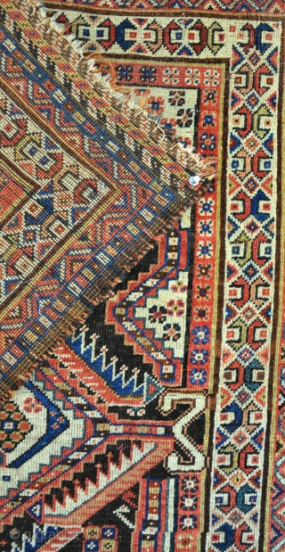 Antique Qasgai square rug, nicely made item in very unusual format. Low pile with some corrosion, bite to top right corner, slight tear in middle, easily fixed if required, 19th century.  