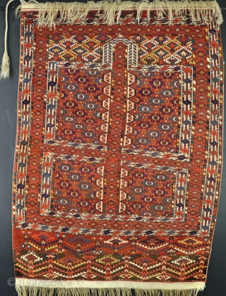 An antique and very colorful Yomud Ensi of fine quality in very good condition for its type. pile just dipping to the collars in one small area, very slightly shaped on one  ...