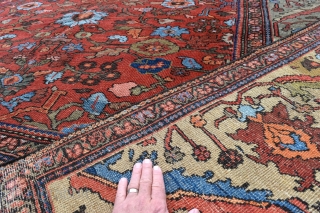 A fine and quite beautiful antique Ferahan carpet. Soft madder ground with large allover design flanked by wide yellow green borders. A top flight furnishing carpet in low pile with some high  ...