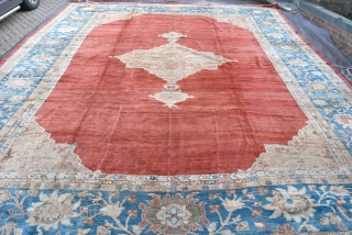 A very large antique carpet from the coveted Ziegler and Co workshop in Arak. 
A top flight carpet of rare square proportions and beautiful soft wool and dyes. Full pile all over,  ...