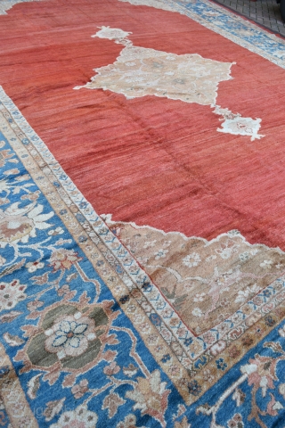 A very large antique carpet from the coveted Ziegler and Co workshop in Arak. 
A top flight carpet of rare square proportions and beautiful soft wool and dyes. Full pile all over,  ...