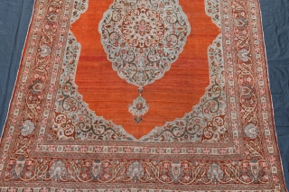 A fine antique Persian Tabriz carpet with soft colours and silky wool. A very clean carpet with even low pile, very slight moth damage here and there, but heavy and solid without  ...