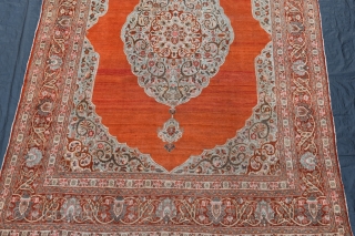 A fine antique Persian Tabriz carpet with soft colours and silky wool. A very clean carpet with even low pile, very slight moth damage here and there, but heavy and solid without  ...