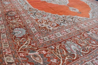 A fine antique Persian Tabriz carpet with soft colours and silky wool. A very clean carpet with even low pile, very slight moth damage here and there, but heavy and solid without  ...